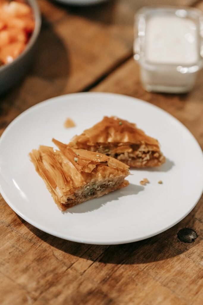 Baklava served on plate on wooden table